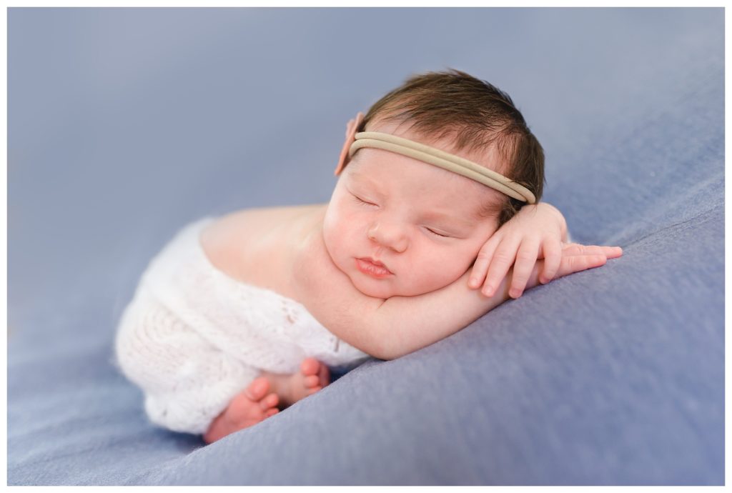 newborn baby on blue background