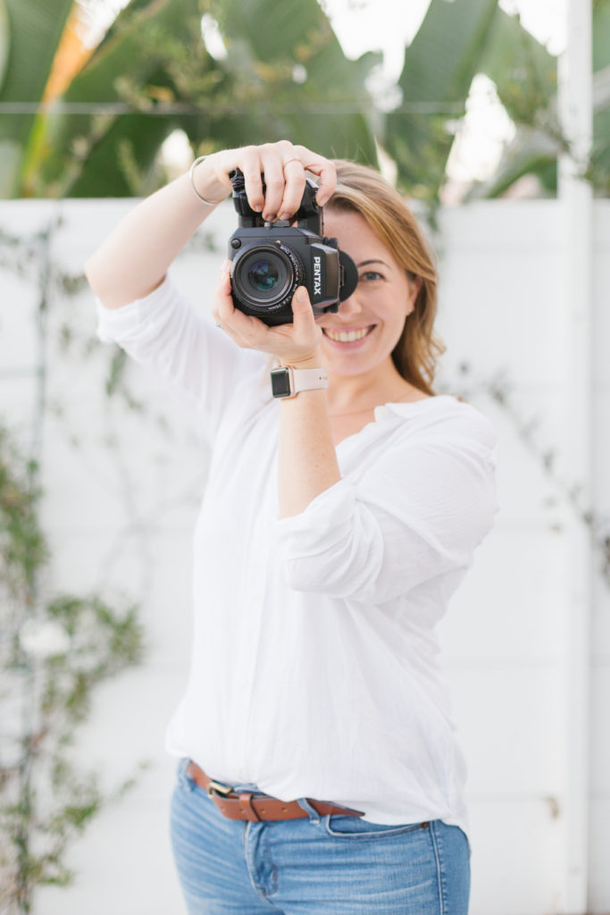 Kate Voda Photography this shows Kate the owner taking a photo