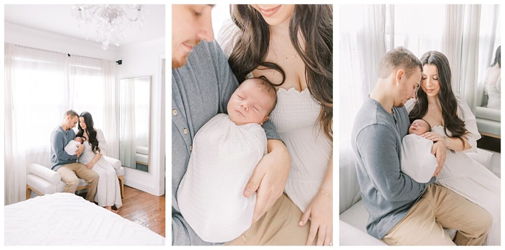 A mother and father hold their newborn boy while sitting on a bench in front of a window indoors during their New Jersey Lifestyle Newborn Session