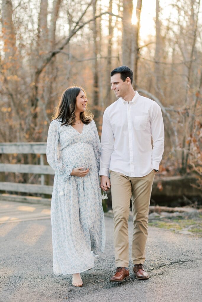 A couple poses during maternity photos at Loantanka Brook Reservation