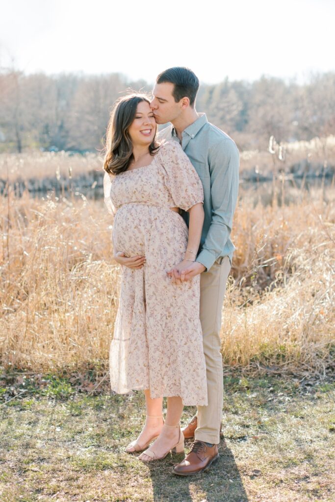 a couple poses during their maternity photos at Loantanka Brook Reservation