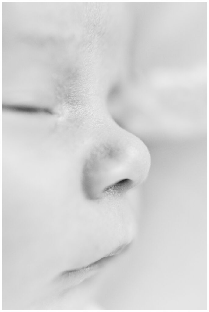 Close up detail image of a baby's nose during newborn photos at home