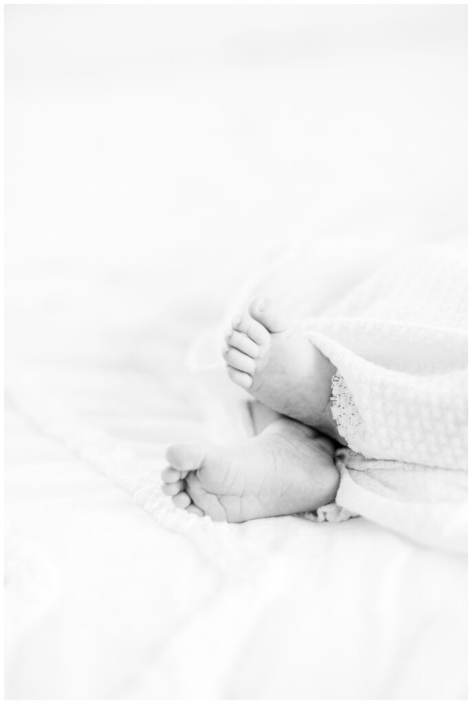 Close up detail image of a baby's feet during newborn photos at home