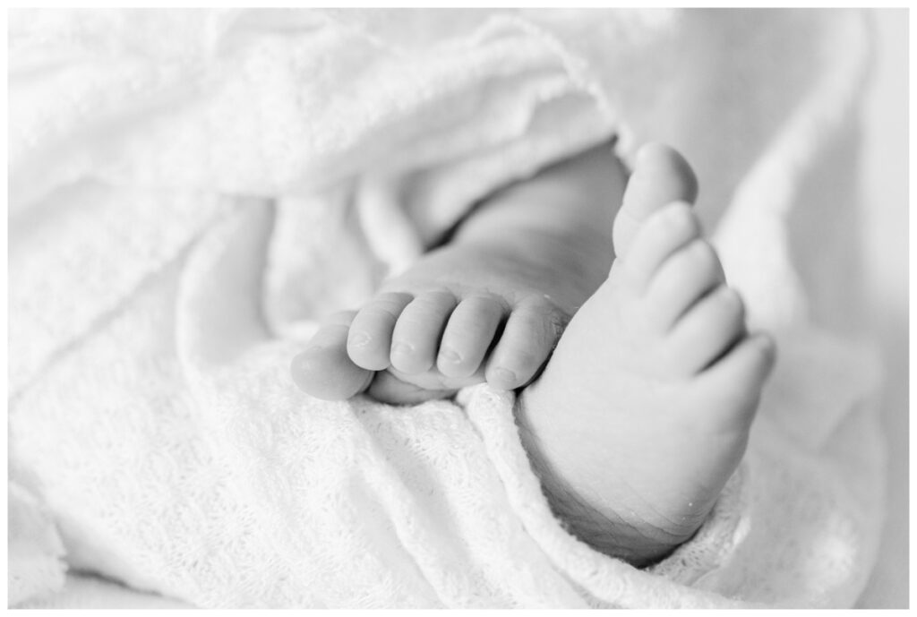 Close up detail image of a baby's toes during newborn photos at home