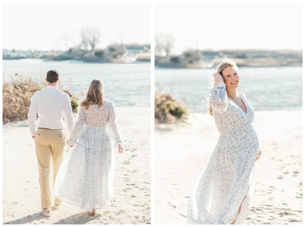 A couple walks down the beach and the woman stops to pose during their beach maternity photos in New Jersey
