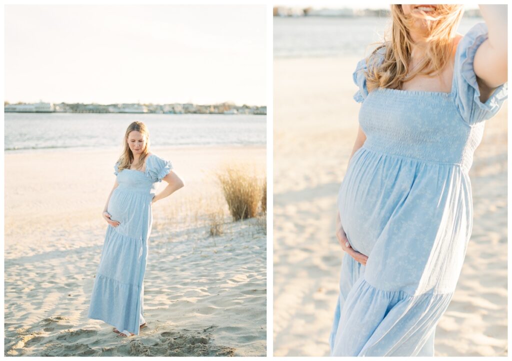 A woman poses on the beach with golden backlight during her beach maternity photos. SHe is wearing a long blue dress with short sleeves