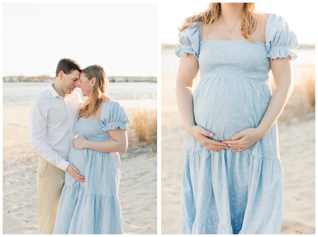 A couple poses together during their beach maternity photos. she is wearing a long blue dress with short sleeves