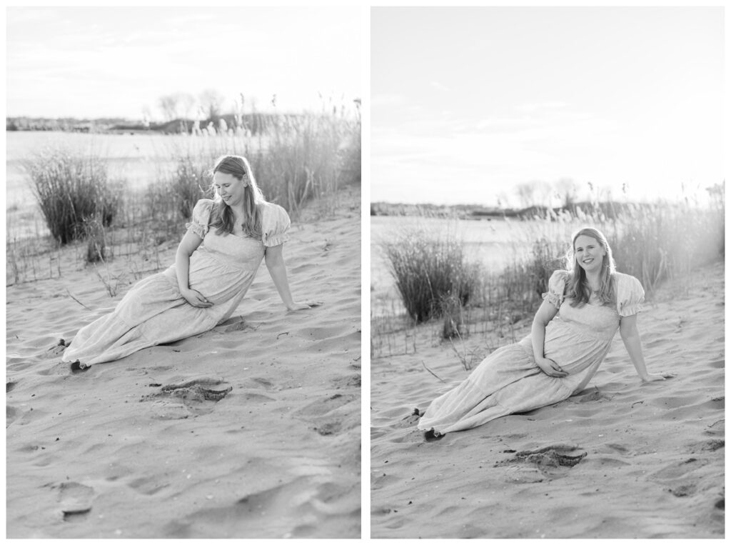 Black and white photos of a woman sitting on the beach cradling her pregnant belly during beach maternity photos