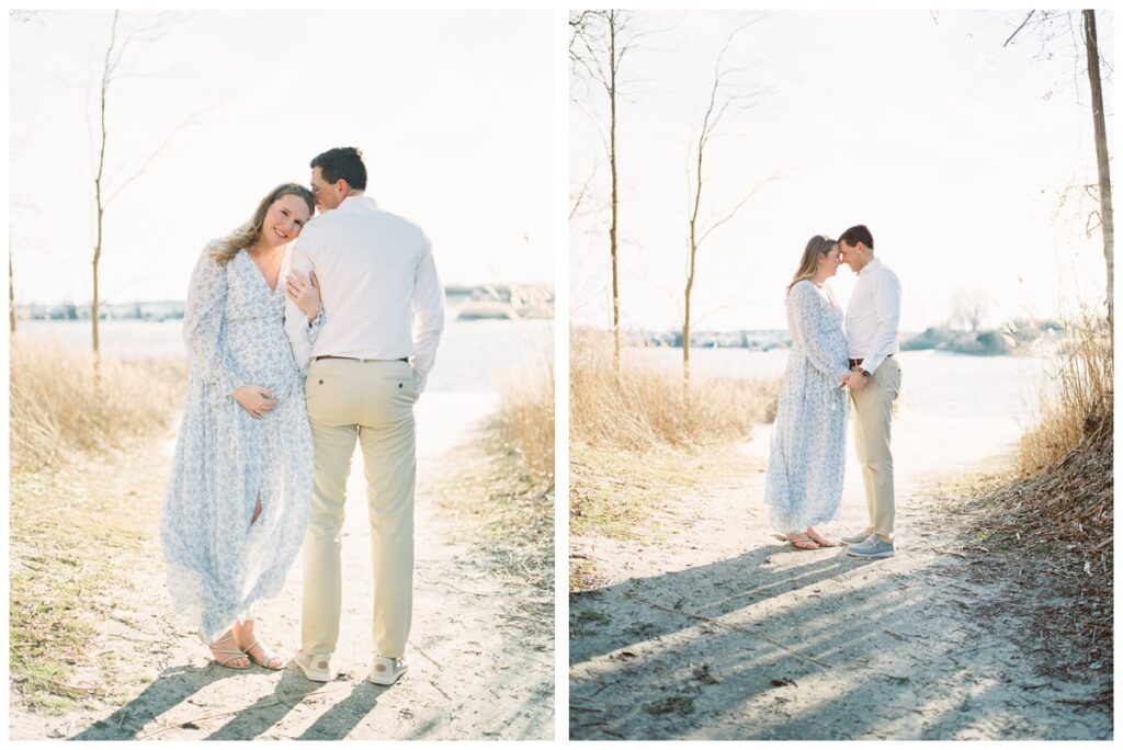 A couple poses on the beach with beautiful golden backlight during their beach maternity photos