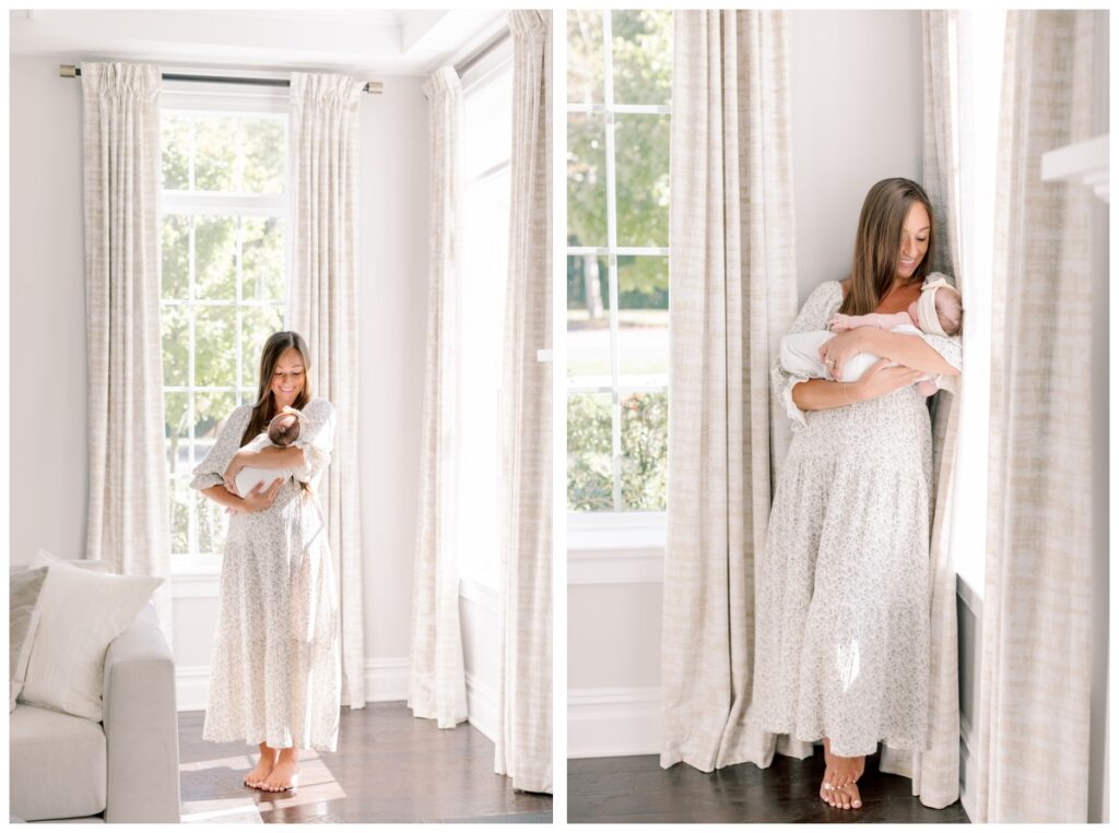 A mother holds her sleeping baby in her livingroom living room during newborn photos photographed by Kate Voda Photography