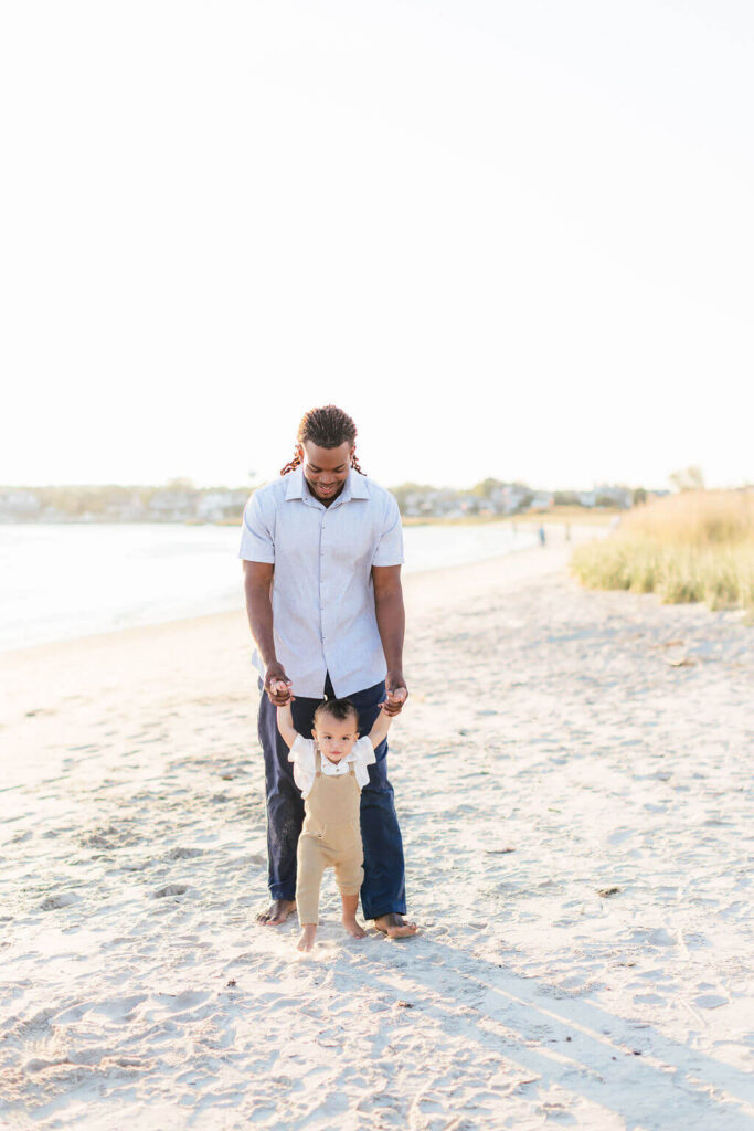 Mini Session, Half, or Full: Which Is Right for Your Family? (2026) dad and toddler first steps fishermans cove