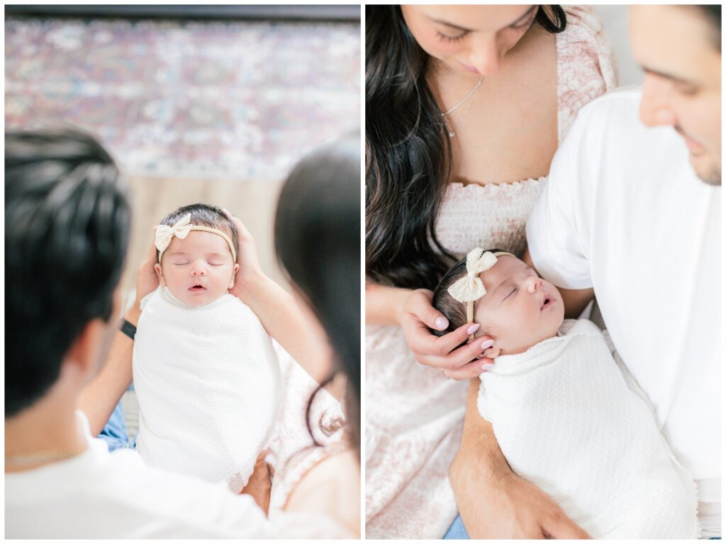 Lifestyle newborn photos in Marlboro, NJ showing parents lovingly holding baby with cream bow headband
