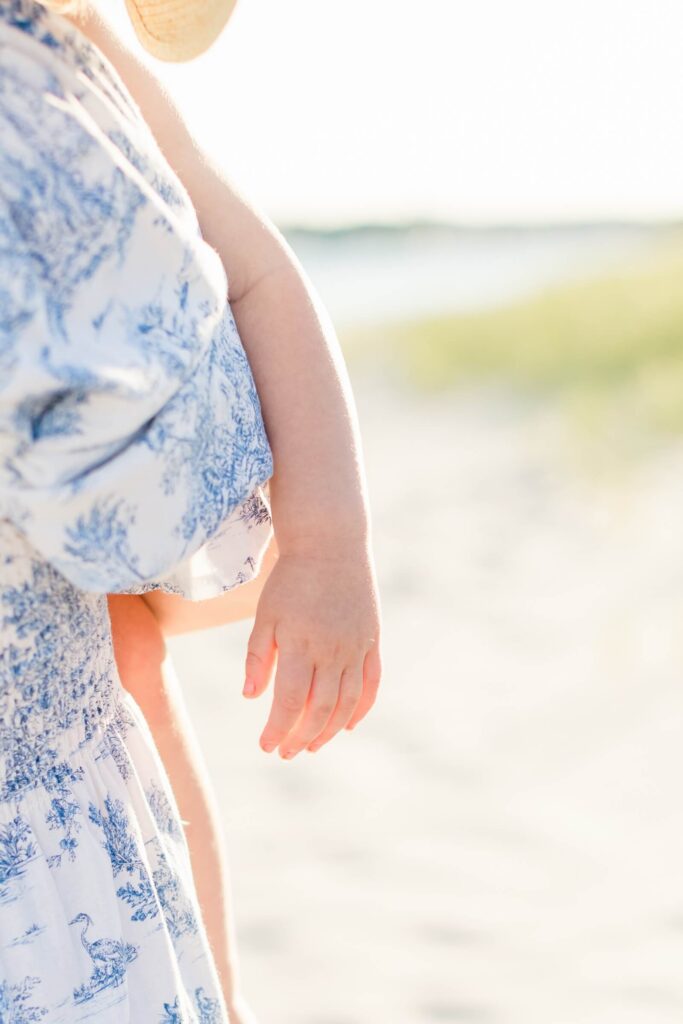 Choosing Privacy in the Age of AI Child's hand and arm at the beach, faces kept private